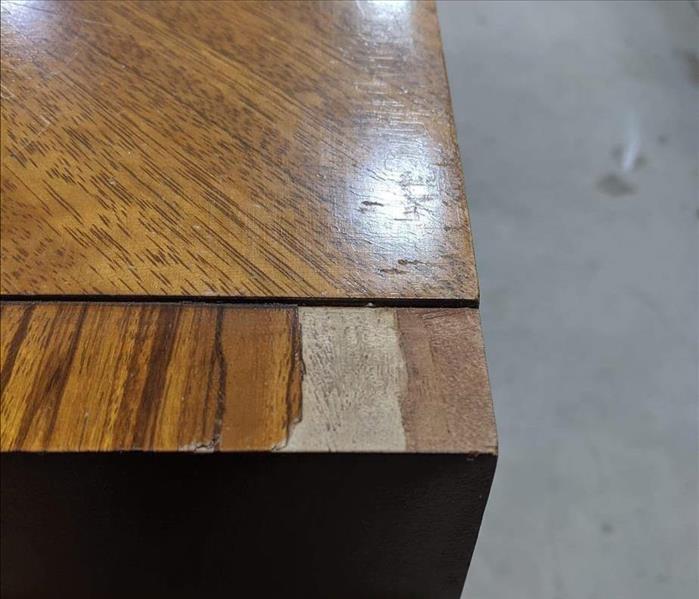 Chipped piece off desk