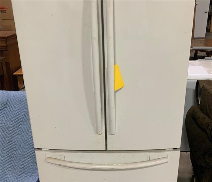 Dust Covered White Refrigerator 